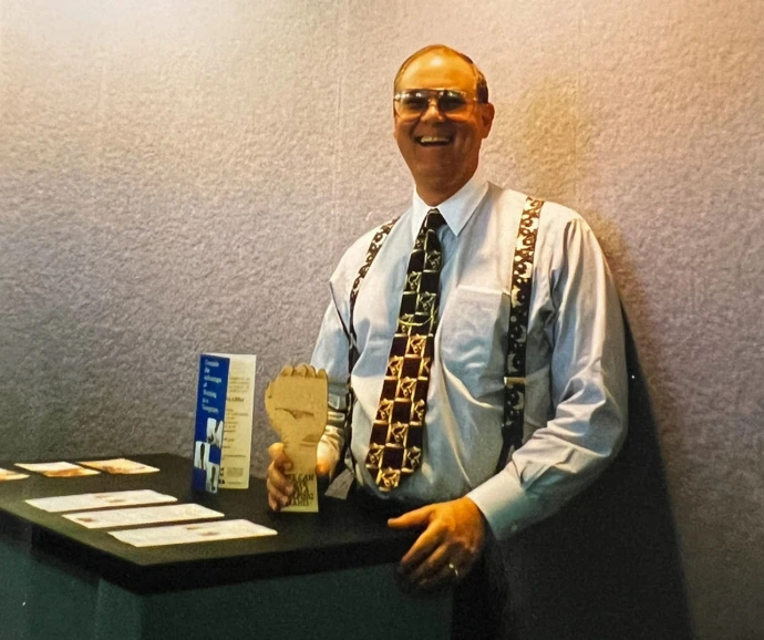 Malcolm receiving an award